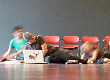 Man laying on the ground with laptop