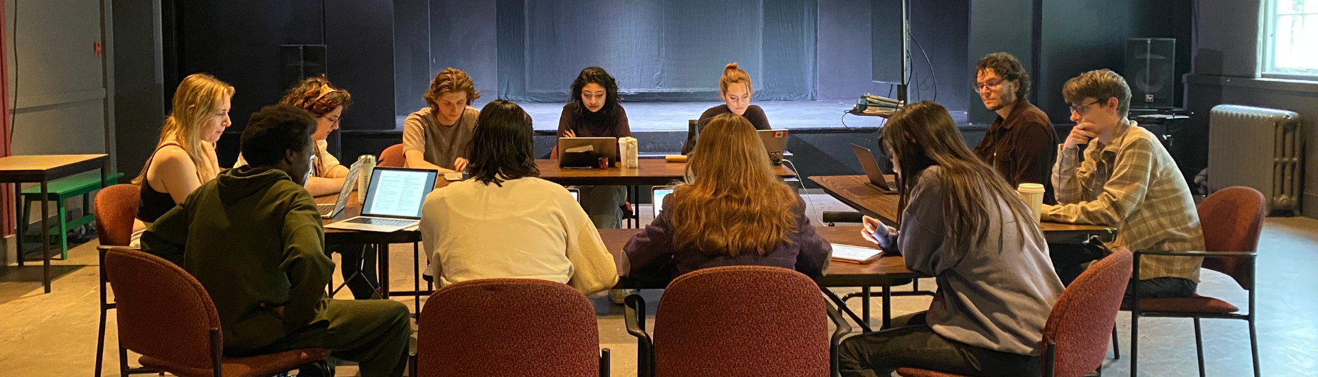CDTPS drama students sitting in collaborative roundtable in the playhouse theatre